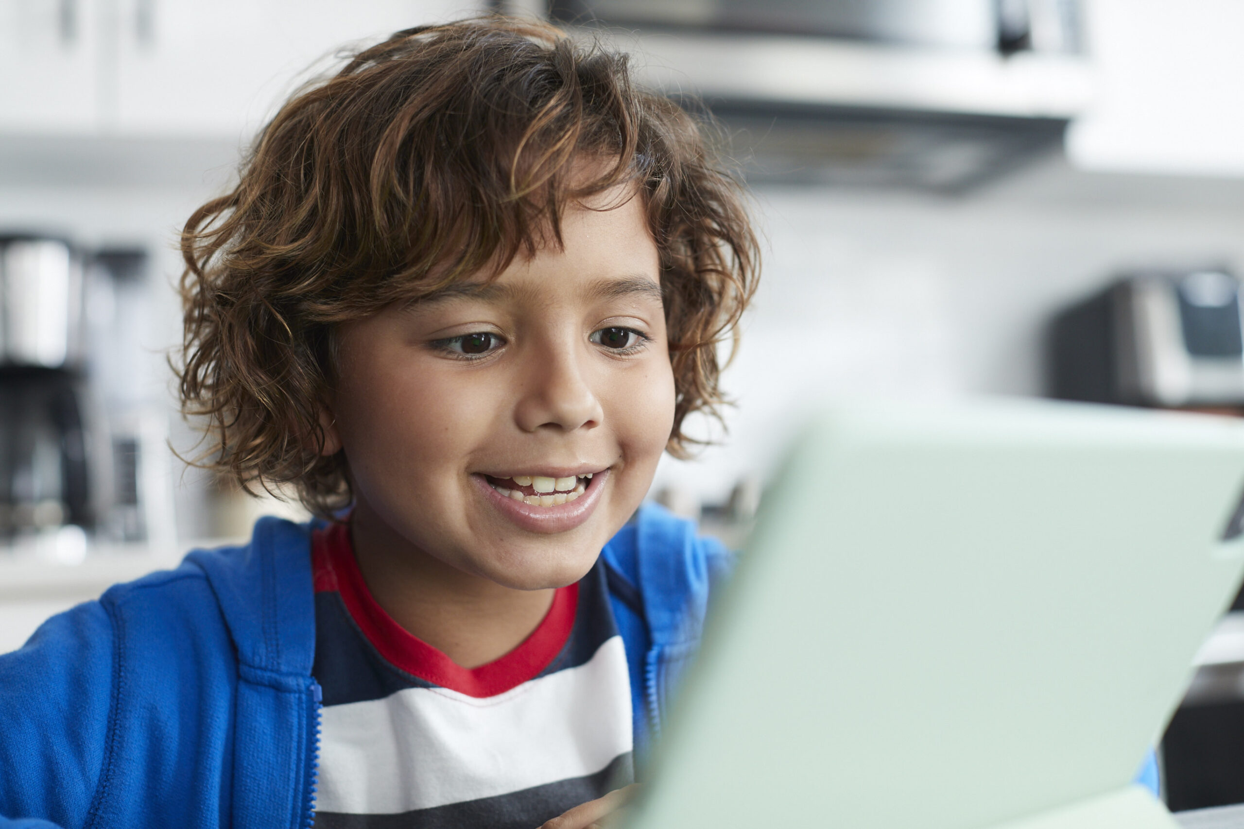 Child reading out loud to a voice-enabled product